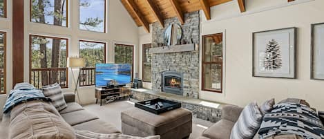 Main living space offers a comfortable L shaped couch and gas fireplace