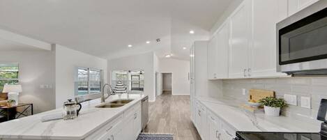 Kitchen with a view of the Cambria botanica quartz countertops