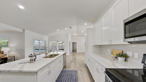 Kitchen with a view of the Cambria botanica quartz countertops