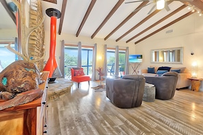 Open concept living area with high ceilings