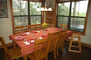 Dining table seats 8 plus a high chair. Island seats 4.