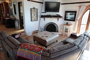 Gas Fireplace to warm you on cool nights. This couch has 3 Recliners and sits 7.