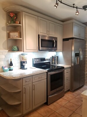 Newly remodeled kitchen with stainless appliances.