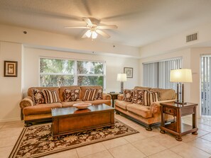 Living room with access to private balcony.
