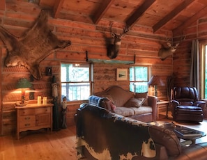 Cliff's mounts, my dad's bear rug, carvings and lamps created by me.