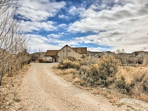 Gravel driveway to our house. Rental is around back.