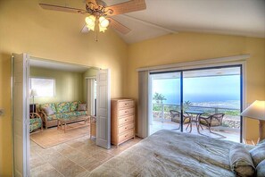 Bedroom with view towards the lanai and the living room