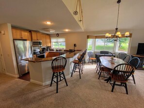 Kitchen is fully stocked for all your cooking needs and includes breakfast bar that seats 4 and a dining table that seats 6