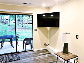 55 inch TV with 140 Comcast channels; walk out patio with table