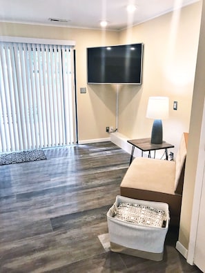 55 inch TV with 140 Comcast channels; walk out patio with table