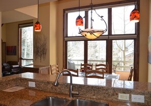 Open Kitchen Plan with Ample Natural Light and Stunning Views