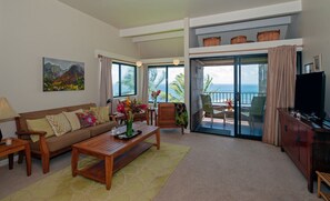 Sealodge G8 | Princeville condos at Sealodge Kauai 5 - The living room is warm and inviting, the perfect place to kick back and watch a movie after a long day spent exploring.