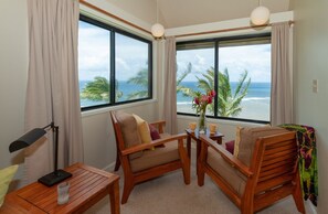Sealodge G8 | Princeville condos at Sealodge Kauai 3 - If it's a rainy day, you can sit inside at the oceanfront windows and enjoy the views while staying cozy and dry! Wherever you are in the house, you'll find awesome views right next to you.