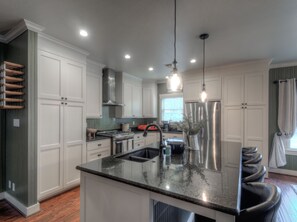 Kitchen: Granite counters, large island with seating for 4, stainless steel app.