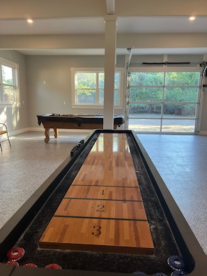 Newly remodeled garage with shuffle board and pool table (no HVAC)