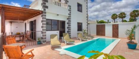 Villa with gated off swimming area and loungers