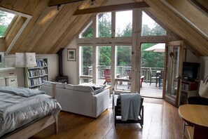 View looking out over deck and forest.