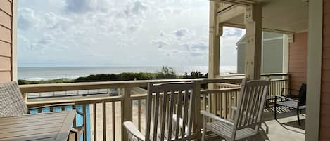 Double porch. Rocking chairs and counter  height set for dolphin watching.