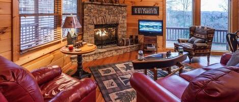 Great room with a flat screen tv and gas log fireplace