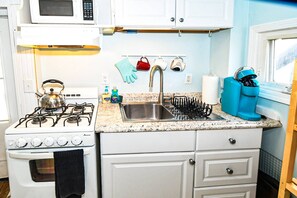Cozy kitchen with Coffee Maker Tea Kettle and Microwave Oven