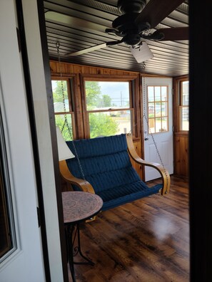 four season indoor porch with swing