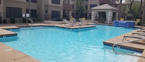 Beautiful front pool with shaded cabana tables!