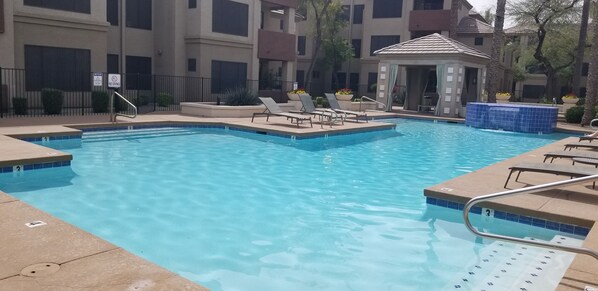 Beautiful front pool with shaded cabana tables!