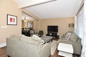 LIVING AND PARTIAL VIEW OF DINING 