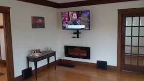 Lovely fireplace and new Smart TVs...perfect for movie nights!