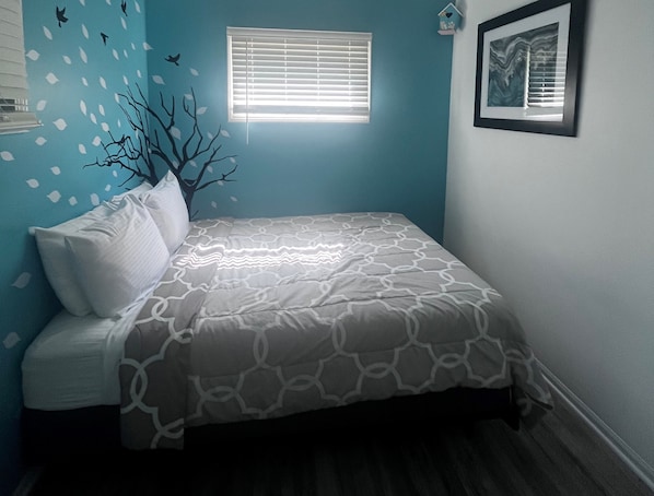 Bedroom with a queen bed. - Bedroom with a queen bed.