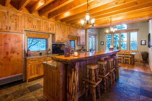 Open plan kitchen, bar seating for 4.