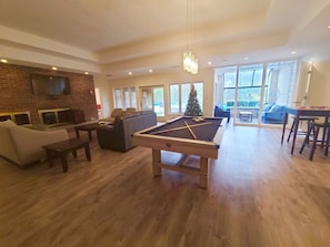 Large living room with pool table (w ping pong top); large sauna/games/bar table