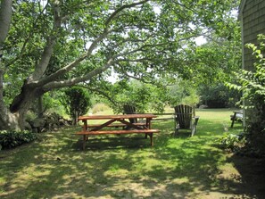 Ancient maples shade the serene setting.