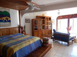 Bedroom and loveseat reading area overlooking the Bay