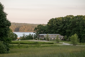 The European drying barn and fields of wild flower with the Sheepscot River