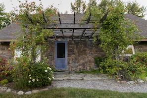 The front arbor over the waterside patio