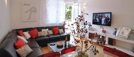 ...relax after a beach day in spacious and comfortable living room with terrace 