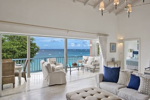 Wide Disappearing Patio Doors Allow The Interior To Flow Seemlessly To The Ocean