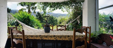 Dining area with lovely views of the mountains by GT House