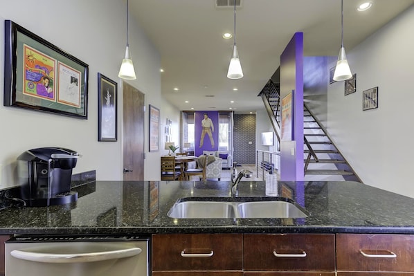 View from kitchen into dining area and den.