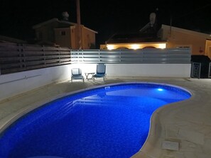 Pool lighting and patio area