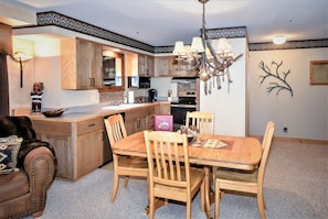 View of dining area and full sized chefs kitchen.