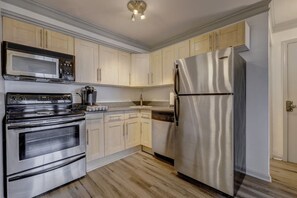 Fully equipped kitchen with stainless steel appliances. 