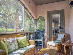 This porch is a great spot to relax with a good book or watch the golfers.