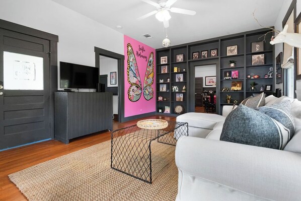 Hand painted TS butterfly mural!  Comfy sofa with pull out queen bed.