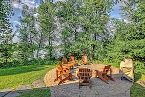 Adirondack chairs around fire pit. 7 in total