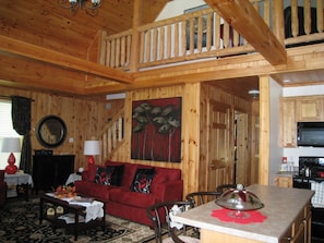 View from kitchen showing hallway to bedrooms and stairs to loft area. 






