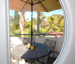 living room deck for outside dining, among trees and ocean views, entertaining