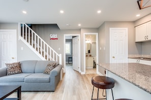 First floor private bedroom is located beside the first floor bathroom.