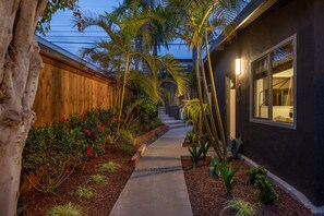 View of the Back in the evening and stairs to private driveway parking.